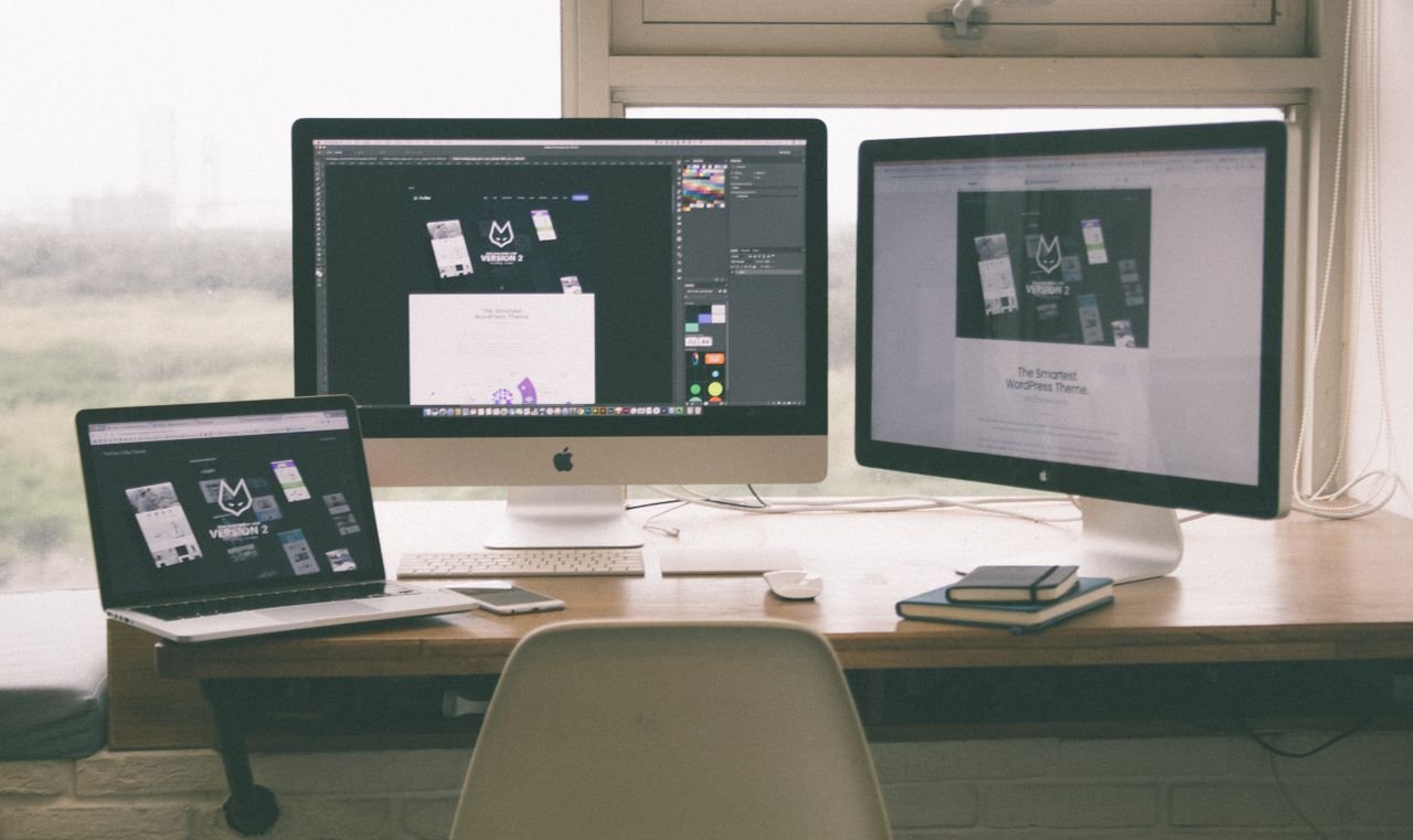 Crafting Captivating Headlines: Your awesome post title goes here Stylish and efficient workspace with multiple monitors, laptop, and smartphone, showcasing a web design project.